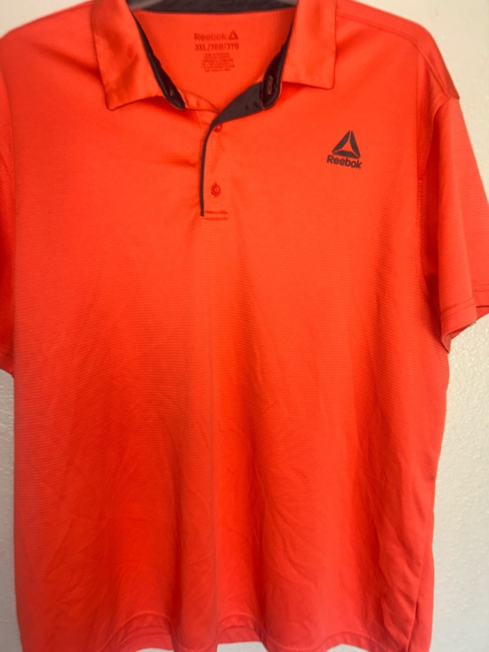 Reebok Men’s Bright Orange Polo with Dark Trim